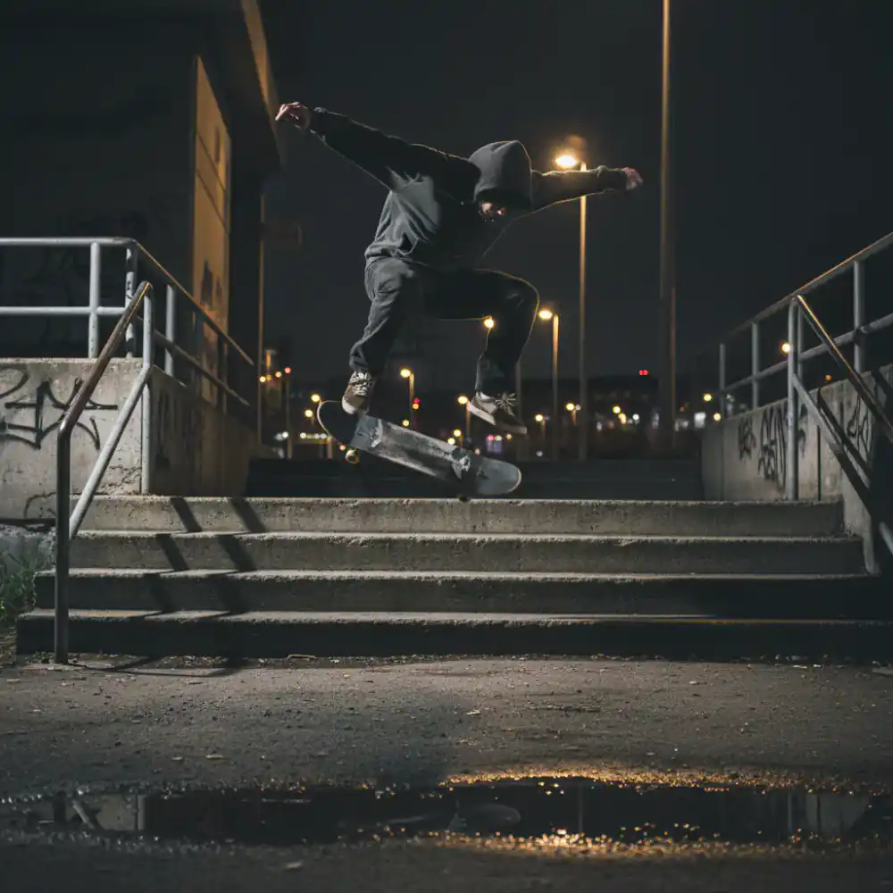 Skater flying over concrete steps